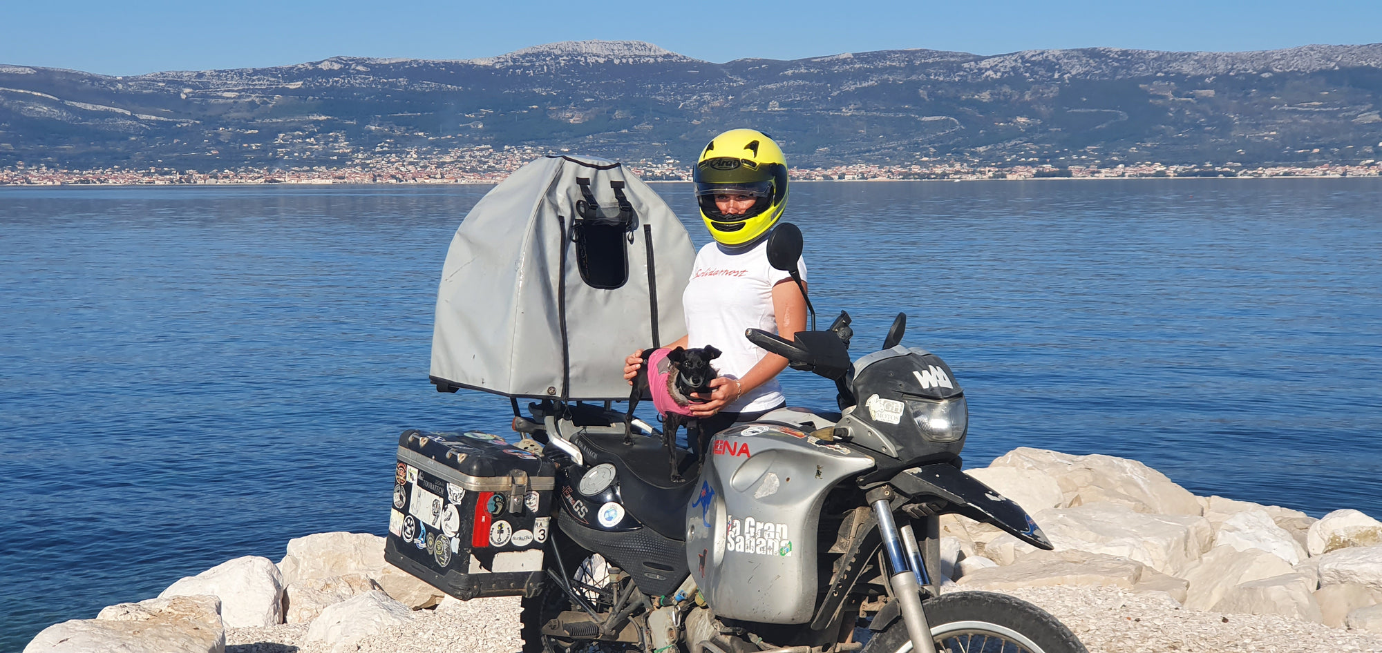 Pillion Pooch Motorcycle Dog Carrier on a BMW F650GS. Photo from The Pack Track of Janell and her biker dog Shadow in Croatia.
