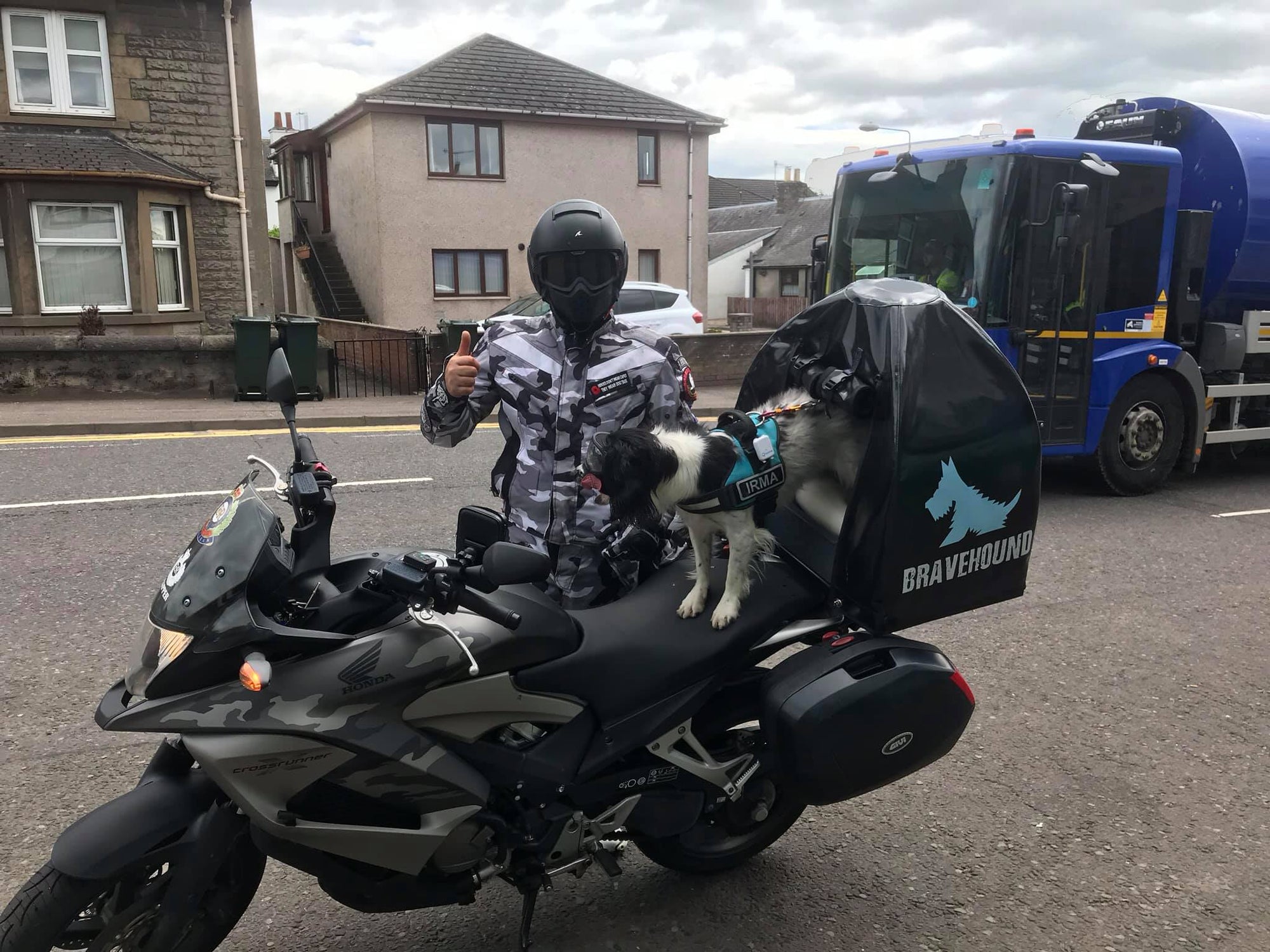 Pillion Pooch Motorcycle Dog Carrier mounted on a Honda Crossrunner. Photo from Paul Wilkie from Scotland with his PTSD service dog Irma wearing Rex Specs.